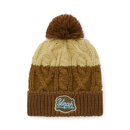 Csavart mintás, kötött sapka bordázott mandzsettával és pomponnal.